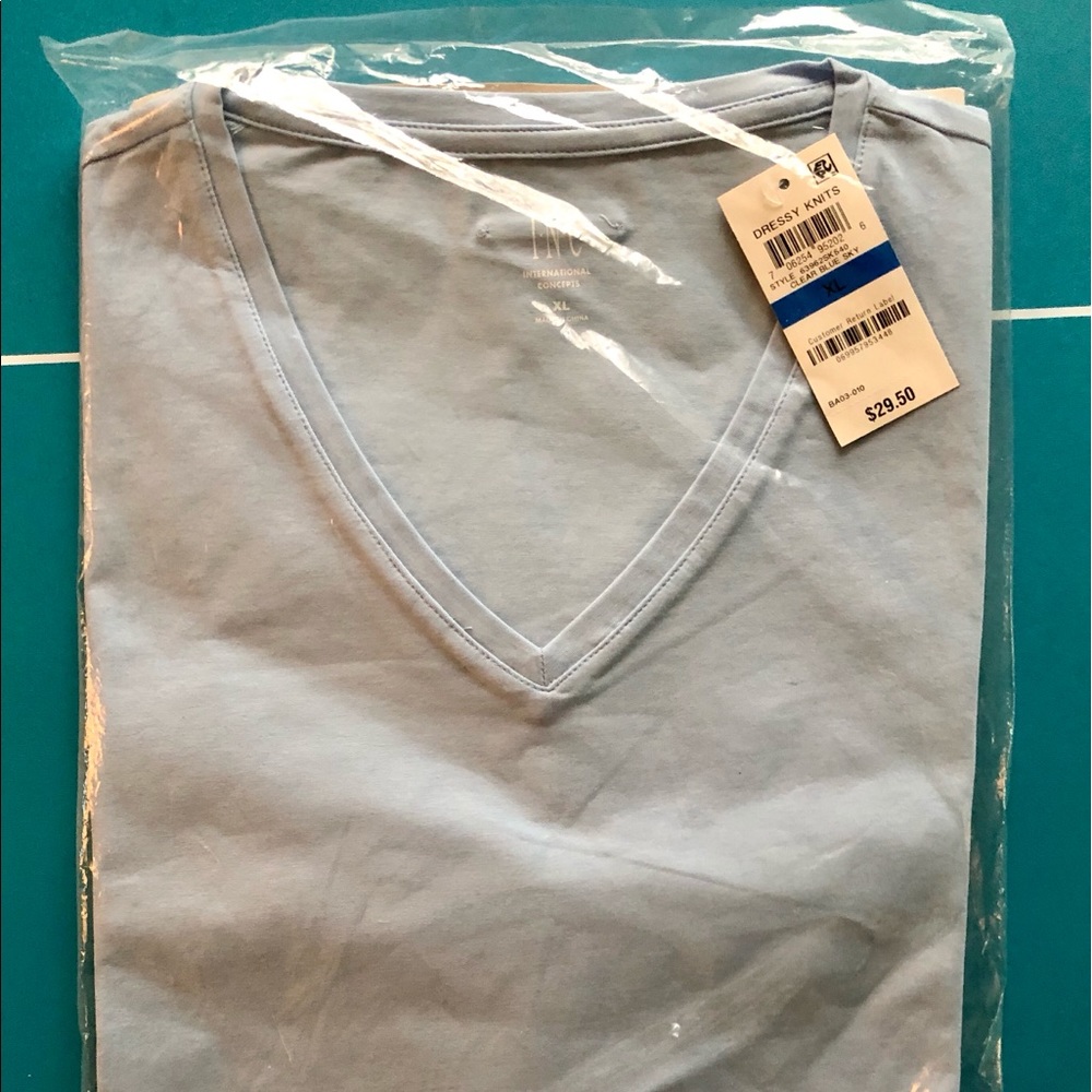 Men’s v-neck dress shirt brand new with tags.